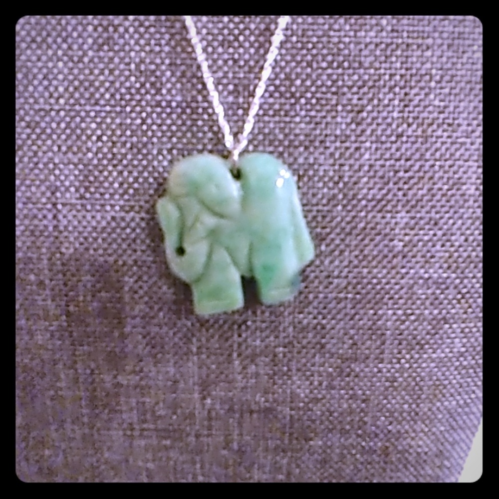 Carved elephant pendant with silver chain